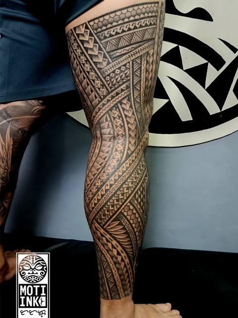 Polynesian tribal full leg sleeve in black ink