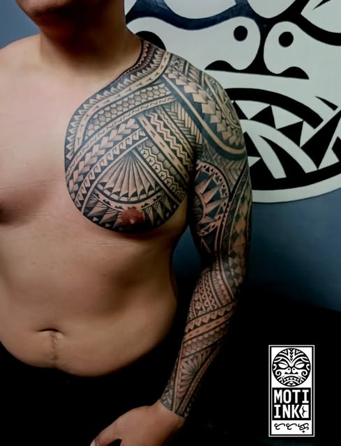 Polynesian blackwork chest and full-sleeve tattoo by Miguel Lagbas / MONTI INK